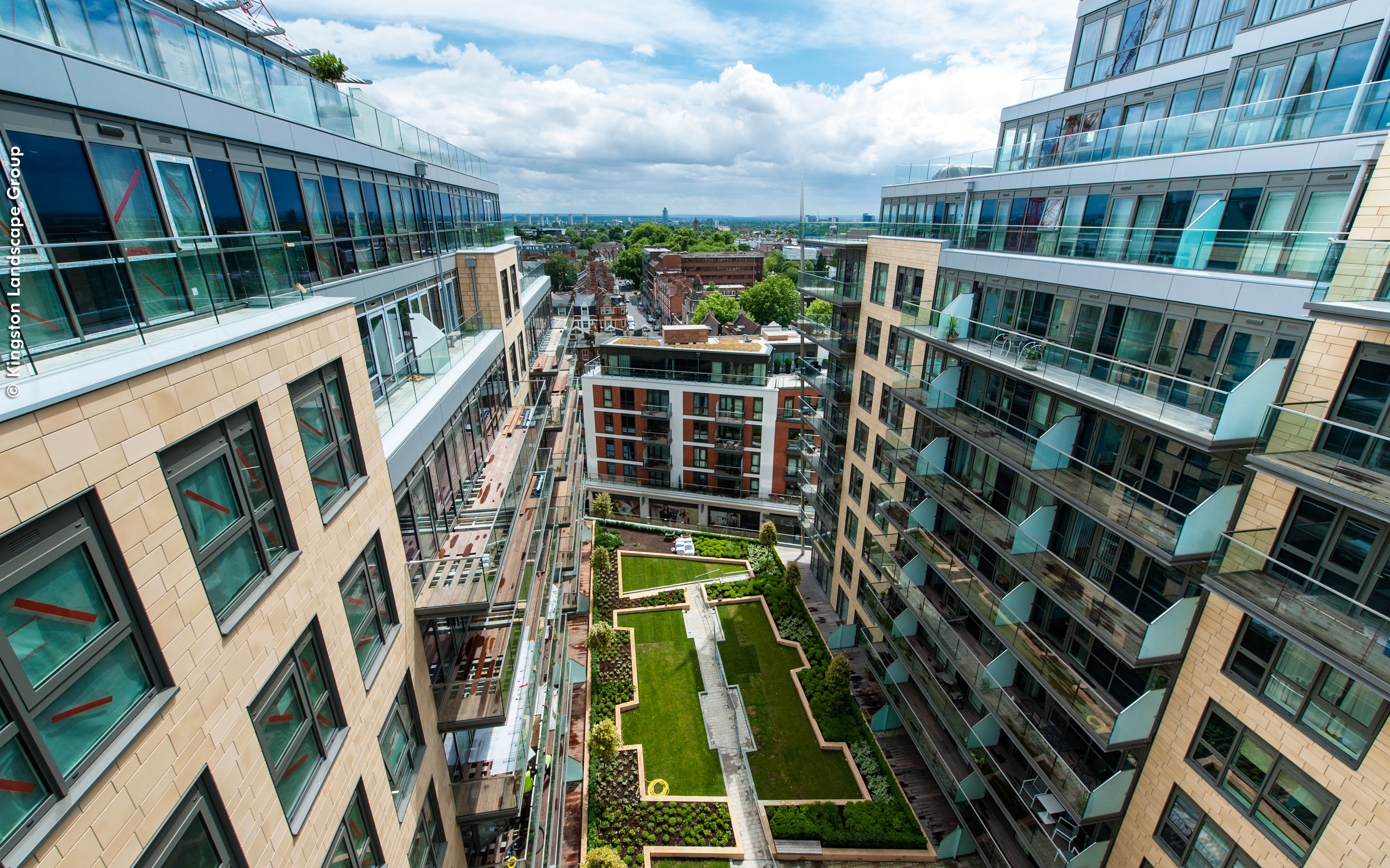 Residents can enjoy the green space from different heights.  View from above onto the courtyard surrounded by high-rise buildings